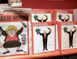 На обложке Charlie Hebdo появилась Меркель с отрезанной головой Шульца